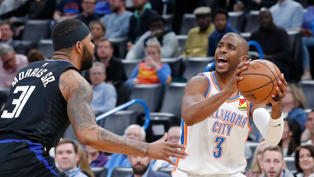 Oklahoma City Thunder point guard Chris Paul looks to pass during a game against the Los Angeles Clippers.